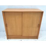 LIGHT MAHOGANY BOOKCASE with a rectangular top above a pair of sliding doors with an adjustable