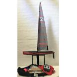 LARGE RADIO CONTROLLED POND YACHT the hull and sail marked 'Focus', with operating instructions,
