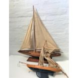 20th CENTURY MAHOGANY MODEL YACHT with a painted dark blue hull, full rigging and mounted on a
