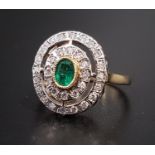 ATTRACTIVE ART DECO STYLE EMERALD AND DIAMOND PLAQUE RING the central oval cut emerald in double