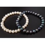 PAIR OF FRESHWATER PEARL BRACELETS one with black pearls and the other white pearls, both on