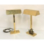 TWO BRASS TABLE LIGHTS with oblong shaped hoods raised on a square column and oblong base, 50cm high