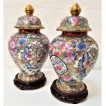 PAIR OF CHINESE FAMILLE ROSE LIDDED GINGER JARS decorated with panels of figures and fauna, 31.5cm