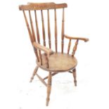 19th CENTURY OAK OPEN ARM CHAIR with a shaped top rail above a turned column back and scroll arms,