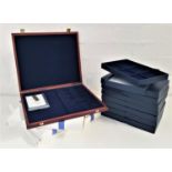 EIGHT BLUE COIN PRESENTATION BOXES with six slot inserts together with three plush lined