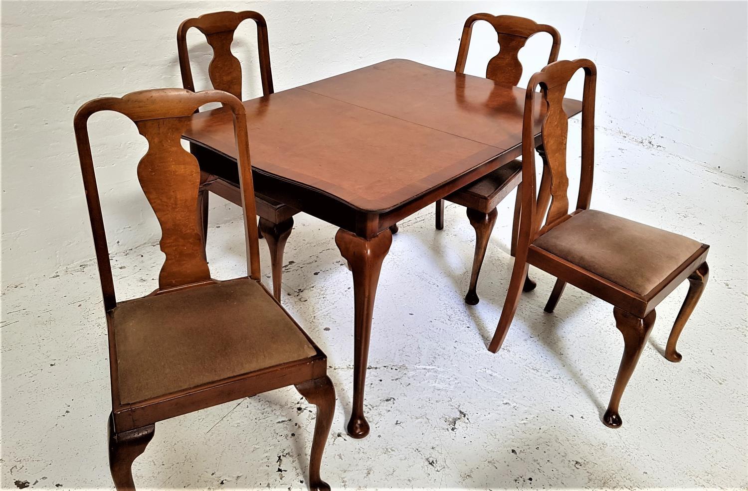 BURR WALNUT AND CROSSBANDED DINING TABLE AND FOUR CHAIRS the table with a shaped pull apart top