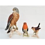 THREE GOEBEL BIRD ORNAMENTS comprising a Kestrel, impressed mark CV 110 and 1969, 23.2cm high; a