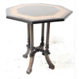 VICTORIAN AESTHITIC MOVEMENT AMBOYNA AND EBONISED OCTAGONAL TABLE standing on four columns with