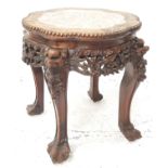 CHINESE HARDWOOD JARDINERE STAND with an inset red veined marble top above a carved frieze, standing