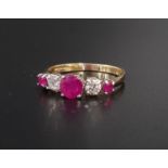 GRADUATED RUBY AND DIAMOND FIVE STONE RING the central round cut ruby approximately 0.5cts and the