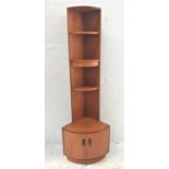 G PLAN TEAK CORNER UNIT with three open shelves above a base with a pair of cupboard doors, standing