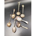 SELECTION OF GEORGE III AND LATER SILVER SPOONS comprising a mother of pearl handled sugar shovel,