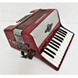 ROYAL STANDARD ACCORDIAN with a mottled red body and shoulder straps