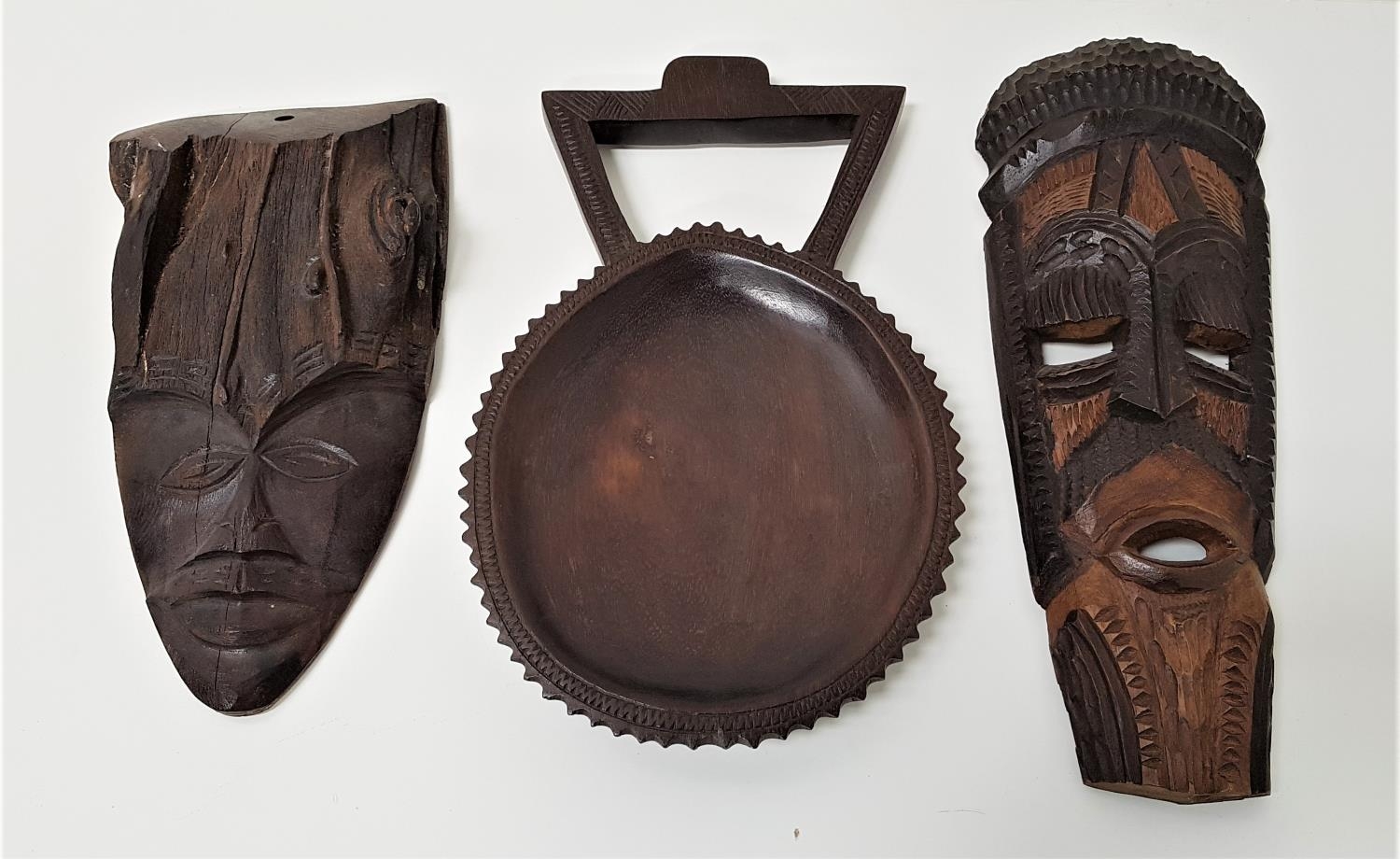 SELECTION OF AFRICAN CARVED HARDWOOD ITEMS including a carved shallow bowl with handle, 30.5cm long;