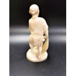 JAPANESE IVORY OKIMONO OF A FISHERMAN Meiji period, holding a net with a crab crawling up it, signed