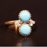 TURQUOISE AND DIAMOND DRESS RING the two round cabochon turquoise stones set in vertical orientation