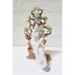 LARGE LLADRO PORCELAIN FIGURINE of a Geisha with a fan seated by a tree, 31cm high