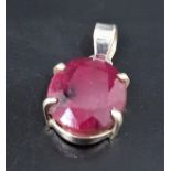 RUBY SINGLE STONE PENDANT the oval cut ruby approximately 18cts, in silver mount, approximately