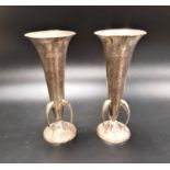 PAIR OF ARTS AND CRAFTS EDWARD VII HAMMERED SILVER VASES each with three pierced scroll handles