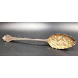 GEORGE III SILVER BERRY SPOON the embossed bowl with gilt interior, London 1803, approximately 54