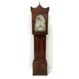 19th CENTURY MAHOGANY LONGCASE CLOCK the arched hood with a central finial above an arched glazed