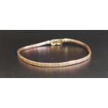 THREE TONE NINE CARAT GOLD BRACELET the snake link bracelet set with alternating yellow, rose and