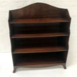 20th CENTURY MAHOGANY WATERFALL BOOKCASE with a shaped and raised back above shaped sides, with four