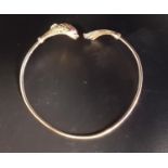NINE CARAT GOLD FISH DECORATED BANGLE the finials with detailed fish body and tail respectively,