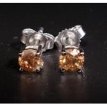 PAIR OF FANCY DIAMOND STUD EARRINGS the round cut diamonds totaling approximately 0.5cts, in nine