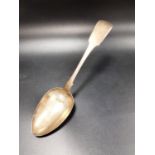 GEORGE IV IRISH SILVER SERVING SPOON the fiddle pattern handle with H monogram, Dublin 1824, maker