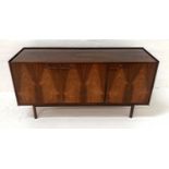 RETRO DANISH TEAK SIDEBOARD with a raised three quarter gallery top above a pair of cupboard doors