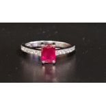 RUBY AND DIAMOND RING the central emerald cut ruby approximately 1ct flanked by diamond set