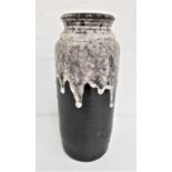 WEST GERMAN POTTERY VASE with a ribbed black ground with speckled drip over glaze, 40cm high