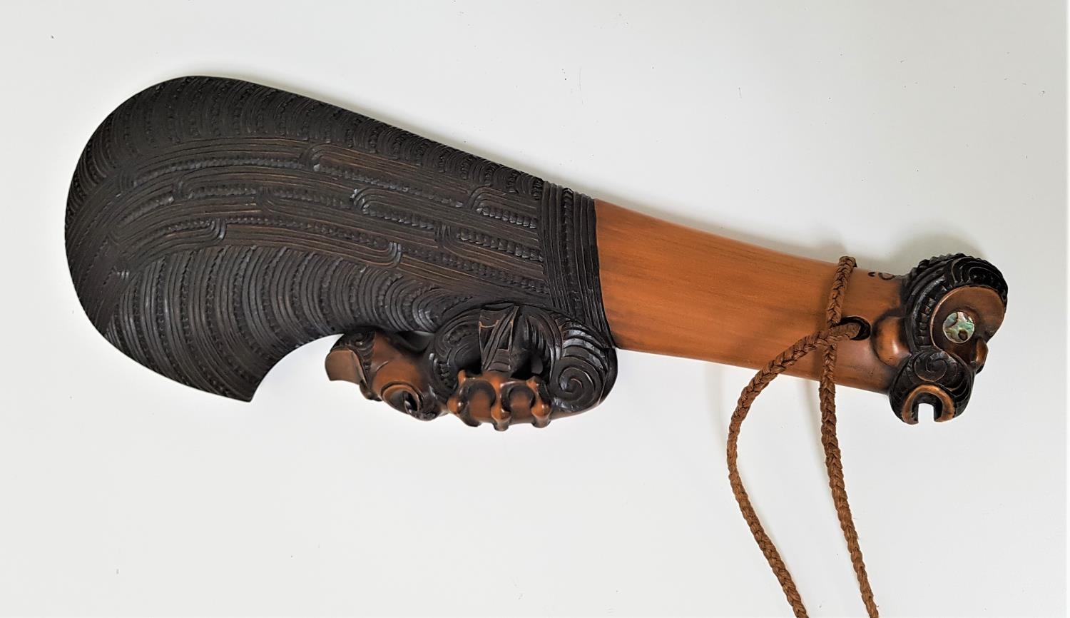 CEREMONIAL MAORI WAHAIKA WAR CLUB with profuse carved decoration and stylised animalia detail, the