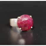 RUBY SET SINGLE STONE RING the checkerboard faceted cabochon ruby on silver shank, ring size Q-R