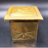 MARGARET GILMOUR ARTS AND CRAFTS BRASS INKWELL repoussé decorated with stylised flowers to the