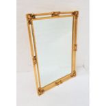 ORNATE GILT FRAME WALL MIRROR with a central bevelled plate and a plain mirror border, 92cm x 66cm