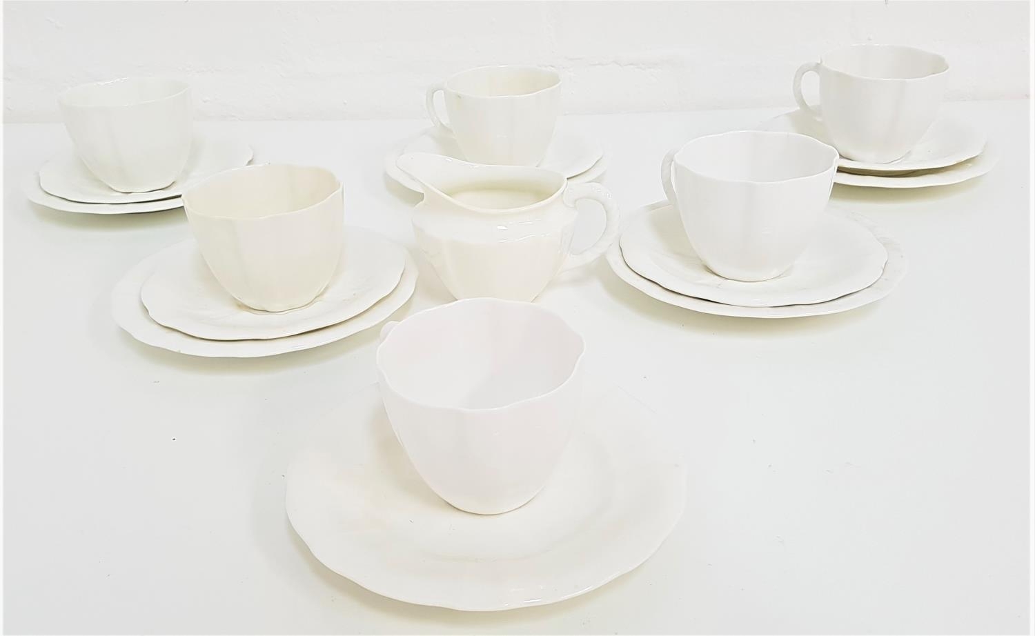 ROYAL CROWN DERBY TEA SERVICE in plain white and comprising six cups, five saucers, six side