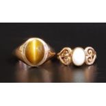 TWO GEM SET NINE CARAT GOLD RINGS comprising an oval cabochon opal ring with decorative pierced