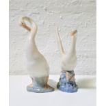 TWO NAO PORCELAIN FIGURINES OF GEESE one preening itself, 23cm high, the other about to take off,
