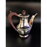 SILVER COFFEE POT with ribbed detail at the rim and to a central band, with composition handle and