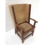 ROBERT TOWERS ORKNEY CHAIR in sapele, with a traditional woven rush back and seat with outswept