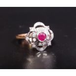 ATTRACTIVE RUBY AND DIAMOND CLUSTER DRESS RING the central ruby approximately 0.25cts in multi