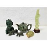 SELECTION OF CARVED JADE COLOURED STONE ORNAMENTS including a teapot and cover, two rhinos, an