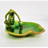 ZSOLNAY EOSIN GLAZED CARD TRAY The Water Carrier, of irregular shape, gilt mark to base, 15cm wide