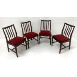 SET OF FOUR MAHOGANY DINING CHAIRS with shaped top rails and slatted backs above a padded seat,