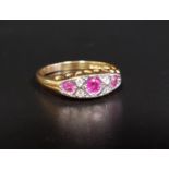 RUBY AND DIAMOND RING the three graduated rubies separated by small diamonds, on eighteen carat gold