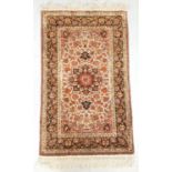 CHINESE RUG with profuse floral decoration and fringed ends, 152cm long excluding fringe