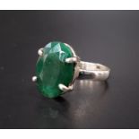 EMERALD SINGLE STONE DRESS RING the oval cut emerald approximately 10cts, on silver shank, ring size