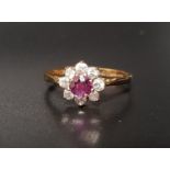 RUBY AND CZ CLUSTER RING the round cut ruby surrounded by eight CZ stones, on nine carat gold shank,